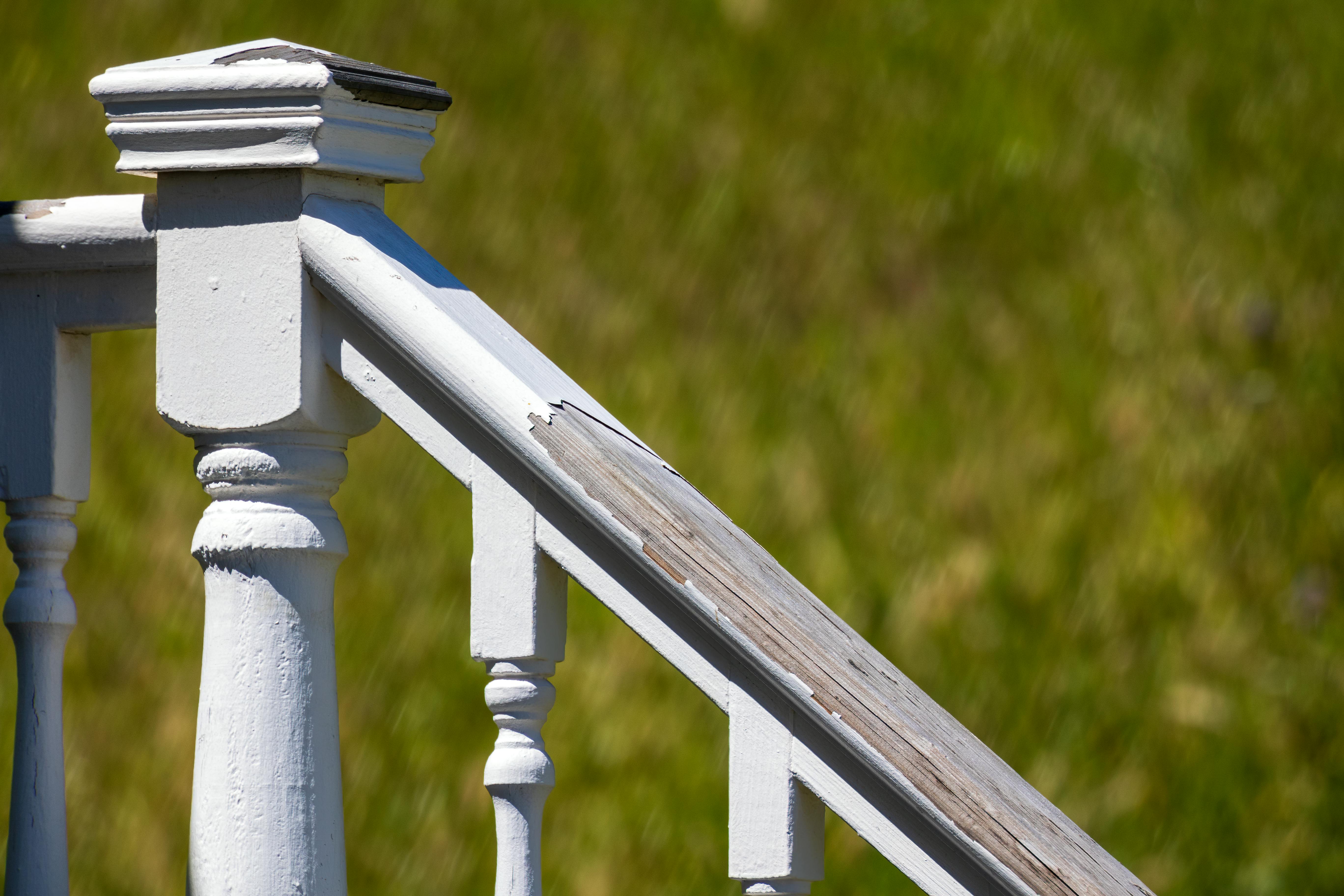Worn Paint on a Patio Bannister